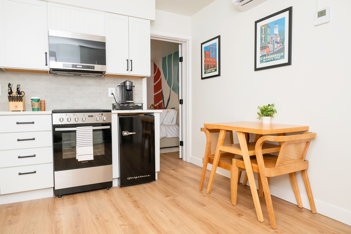 Kitchen and dining nook with Cambridge art
